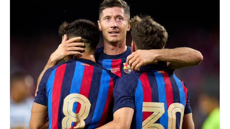 Barcelona players celebrate after scoring a goal
