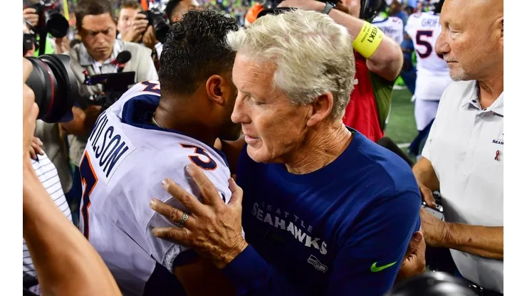 Broncos quarterback Russell Wilson (left) and Seahawks head coach Pete Carroll.