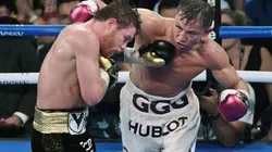 Gennady Golovkin (R) throws a right at Canelo Alvarez