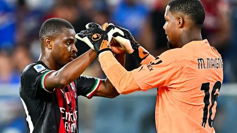 Pierre Kalulu (L) and Mike Maignan of Milan