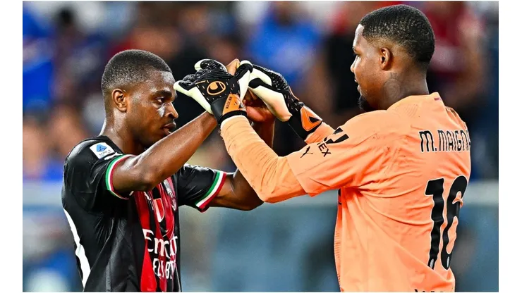 Pierre Kalulu (L) and Mike Maignan of Milan