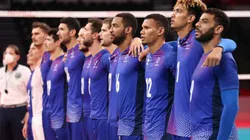 Players of Team France stand together for their national anthem