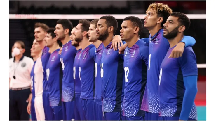Players of Team France stand together for their national anthem
