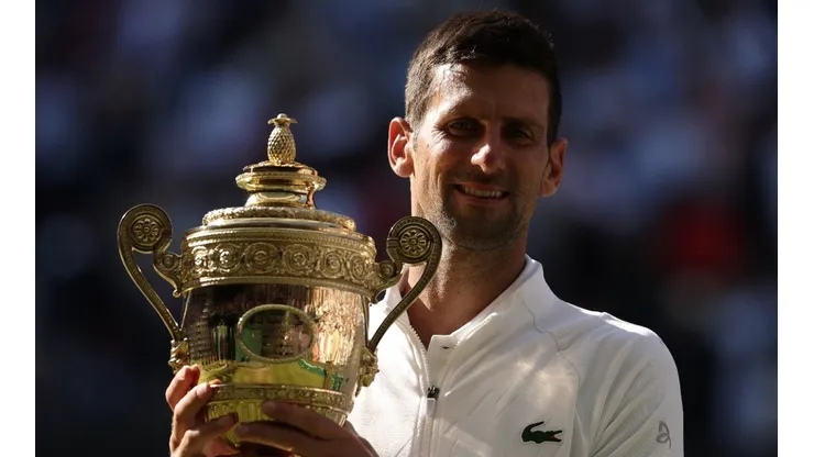 Novak Djokovic of Serbia with his 2022 Wimbledon trophy