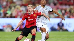 Donny van de Beek of Manchester United competes for the ball against Fabinho of Liverpool