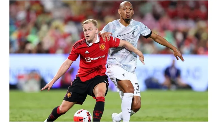 Donny van de Beek of Manchester United competes for the ball against Fabinho of Liverpool