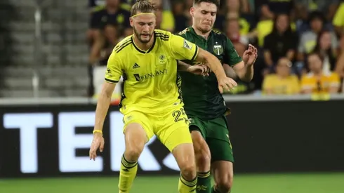 Walker Zimmerman of Nashville SC battles for the ball with Jarosław Niezgoda of Portland Timbers