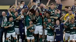 Felipe Melo and Gustavo Gomez of Palmeiras lift the Copa Libertadores trophy