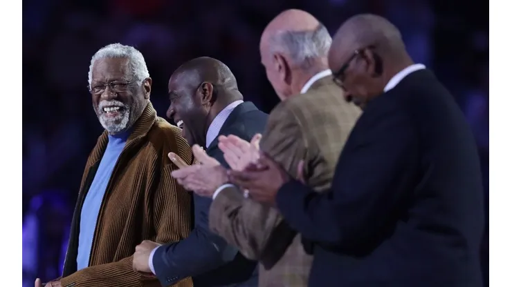 Former NBA players Bill Russell (L) and Earvin "Magic" Johnson Jr. react as they are honored during the 2017 NBA All-Star Game