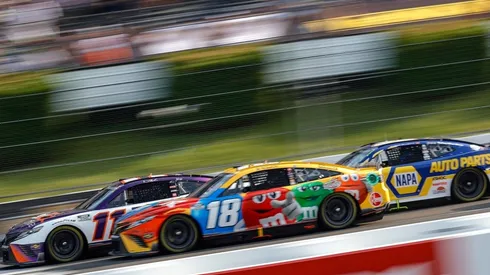 Denny Hamlin, Kyle Busch, and Chase Elliott fight for the first place in Pocono