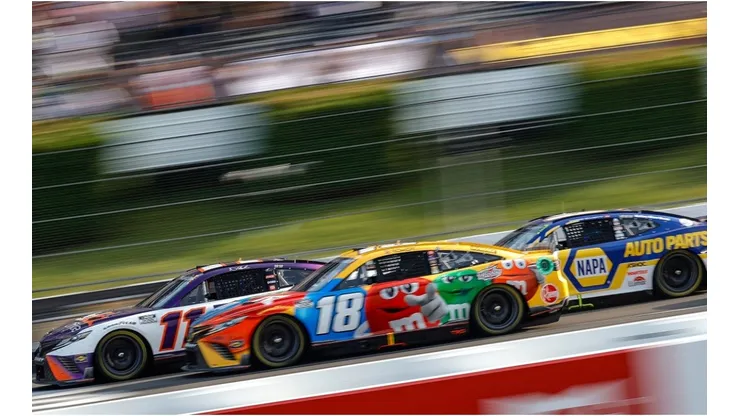 Denny Hamlin, Kyle Busch, and Chase Elliott fight for the first place in Pocono