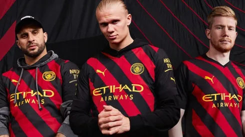 Manchester City unveil black and red striped away jersey