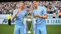 Kevin De Bruyne and John Stones of Manchester City celebrate with the Premier League trophy