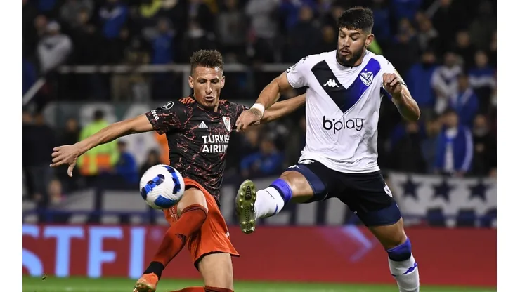 Braian Romero of River Plate (left) against Matias de los Santos of Velez.