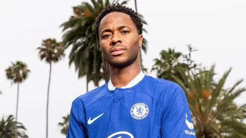 Raheem Sterling posing with the Chelsea jersey.