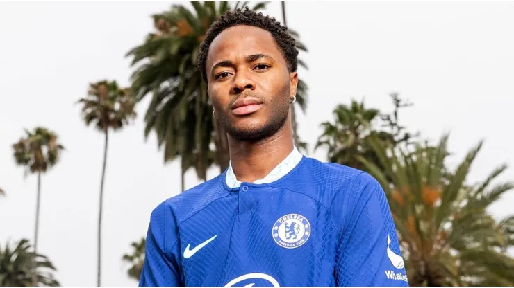 Raheem Sterling posing with the Chelsea jersey.