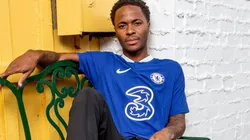 Raheem Sterling poses with the Chelsea jersey.