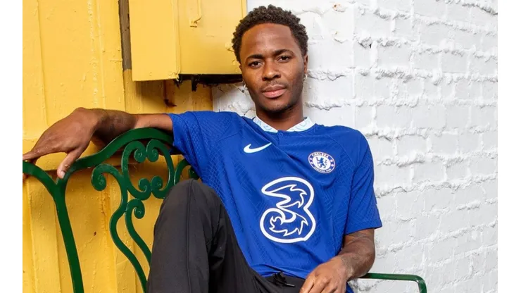 Raheem Sterling poses with the Chelsea jersey.