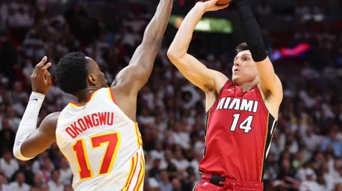 Tyler Herro of the Miami Heat shoots over Onyeka Okongwu of the Atlanta Hawks