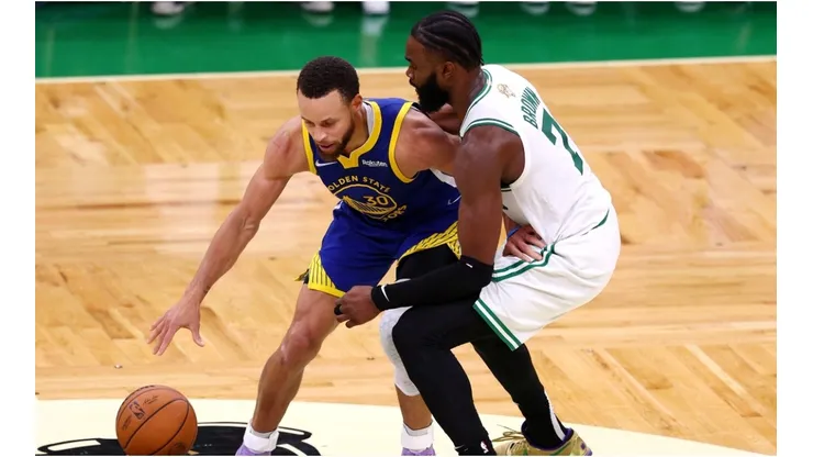 Stephen Curry of the Golden State Warriors is defended by Jaylen Brown of the Boston Celtics