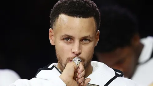 Stephen Curry of the Golden State Warriors kisses at his NBA Championship ring