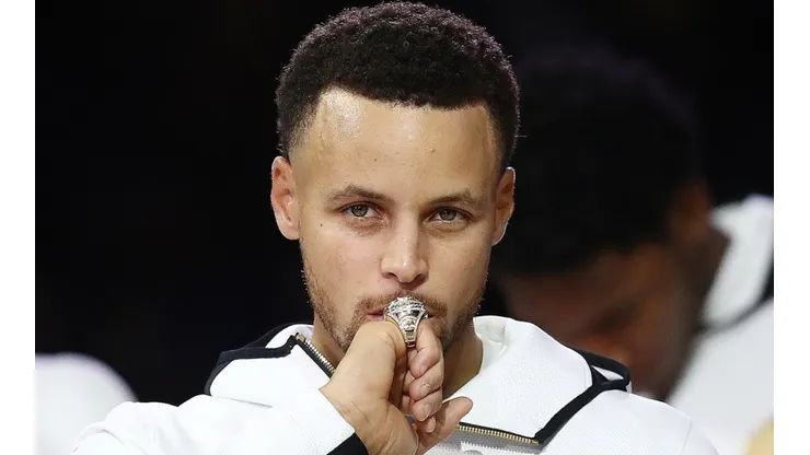 Stephen Curry of the Golden State Warriors kisses at his NBA Championship ring