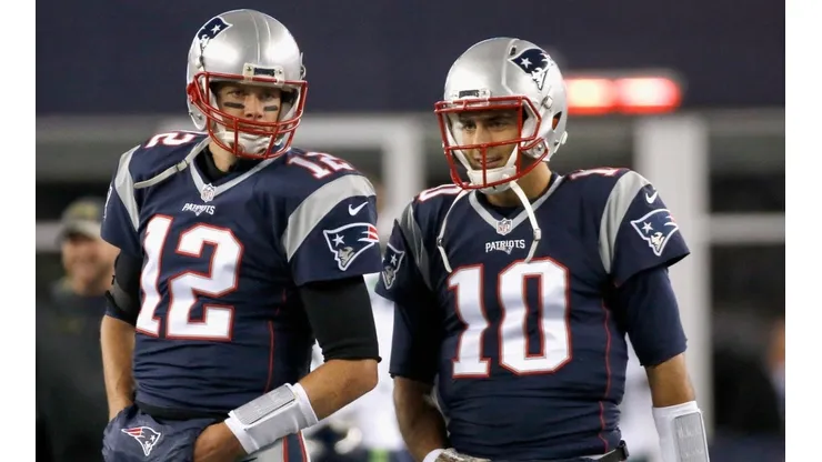 Tom Brady (left) and Jimmy Garoppolo during their time in New England.