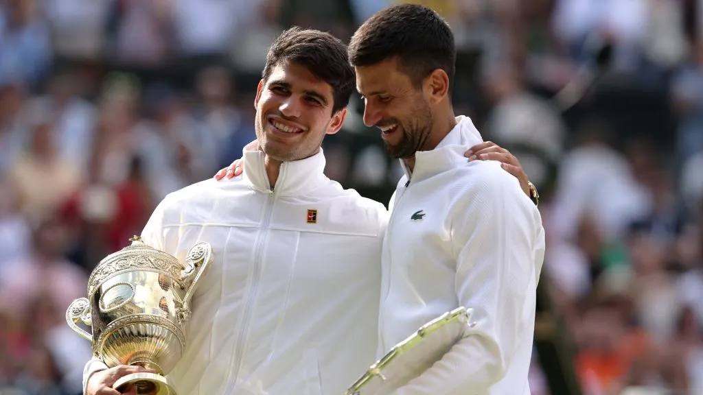 Carlos Alcaraz of Spain with the trophy alongside runner up Novak Djokovic of Serbia after Wimbledon final. Julian Finney/Getty Images