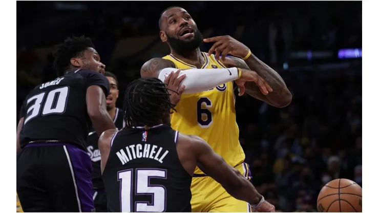 LeBron James of the Los Angeles Lakers reacts as he is stripped of the ball by Davion Mitchell of the Sacramento Kings