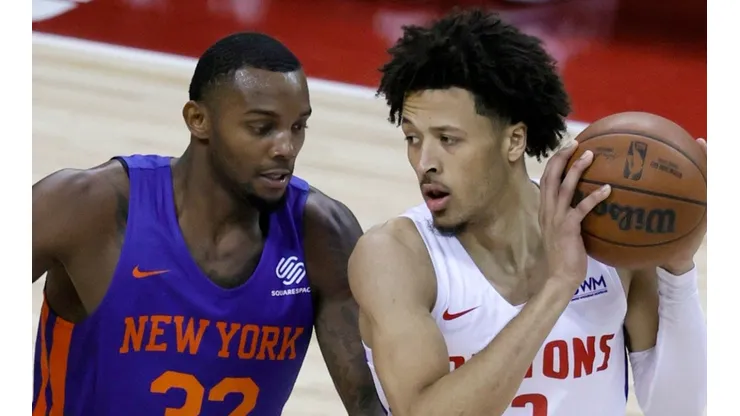 Cade Cunningham of the Detroit Pistons and Aamir Simms of the New York Knicks during the 2021 NBA Summer League