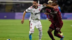 Éverton Ribeiro of Flamengo fights for the ball Junior Hernández of Deportes Tolima