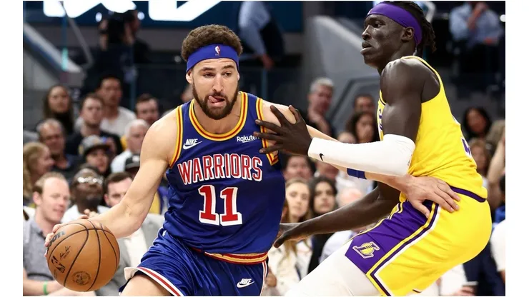 Klay Thompson of the Golden State Warriors is guarded by Wenyen Gabriel of the Los Angeles Lakers