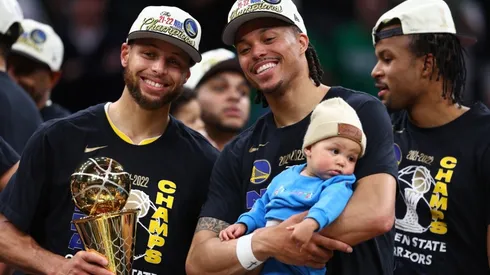 Stephen Curry and Damion Lee of the Golden State Warriors celebrate after defeating the Boston Celtics