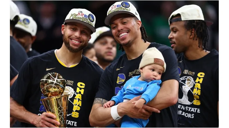 Stephen Curry and Damion Lee of the Golden State Warriors celebrate after defeating the Boston Celtics