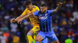 Igor Lichnovsky of Tigres battles for the ball against Juan Escobar of Cruz Azul