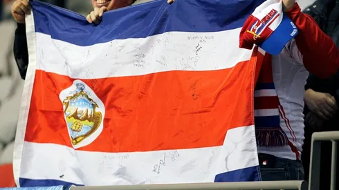 Costa Rican fans hold their contry's flag