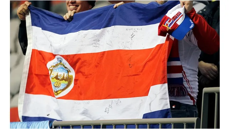 Costa Rican fans hold their contry's flag