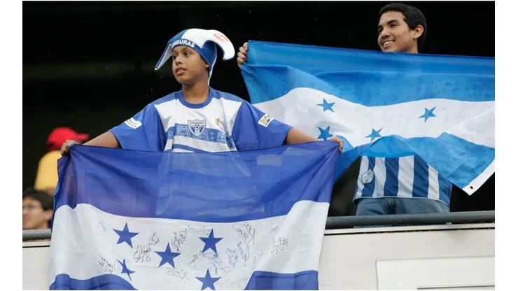 Fans of Honduras hold up flags in support of their team