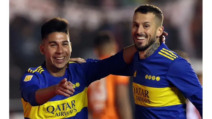 Guillermo Fernandez of Boca Juniors celebrates with teammate Dario Benedetto