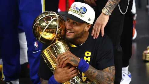 Gary Payton II with the Larry O'Brien trophy as champion