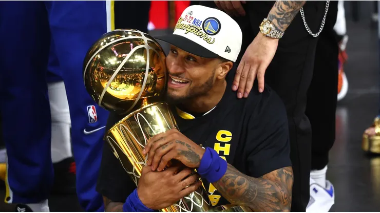 Gary Payton II with the Larry O'Brien trophy as champion