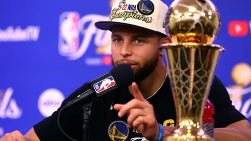Curry with the NBA Championship trophy
