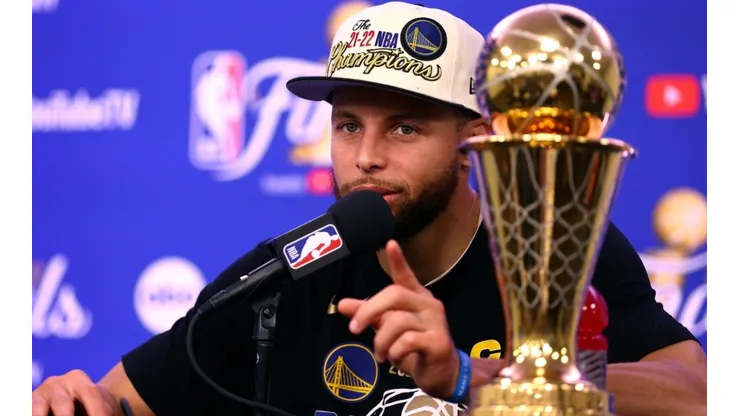 Curry with the NBA Championship trophy