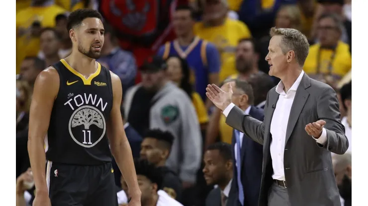 Klay Thompson #11 and Head coach Steve Kerr of the Golden State Warriors
