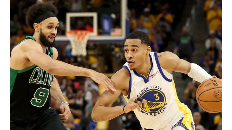 Jordan Poole of the Golden State Warriors and Derrick White of the Boston Celtics