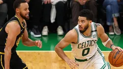 Jayson Tatum of the Boston Celtics drives past Stephen Curry of the Golden State Warriors