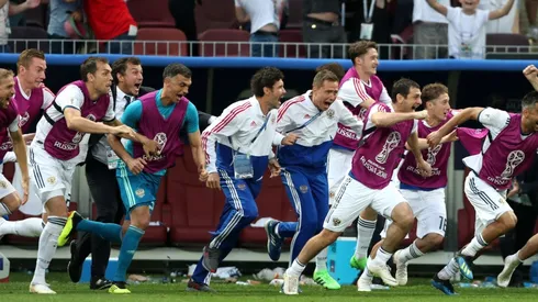 The Russian sustitutes explode after their country scores a goal during the FIFA World Cup 2018