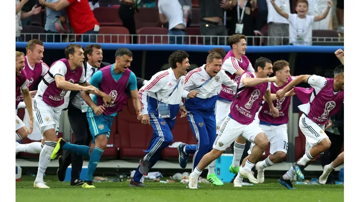 The Russian sustitutes explode after their country scores a goal during the FIFA World Cup 2018