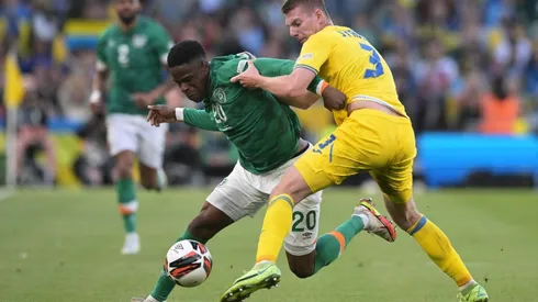 Chiedozie Ogbene of Republic of Ireland is tackled by Oleksandr Syrota of Ukraine