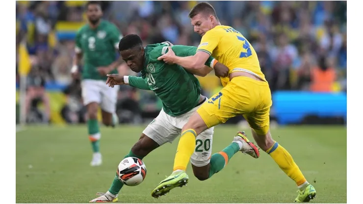 Chiedozie Ogbene of Republic of Ireland is tackled by Oleksandr Syrota of Ukraine